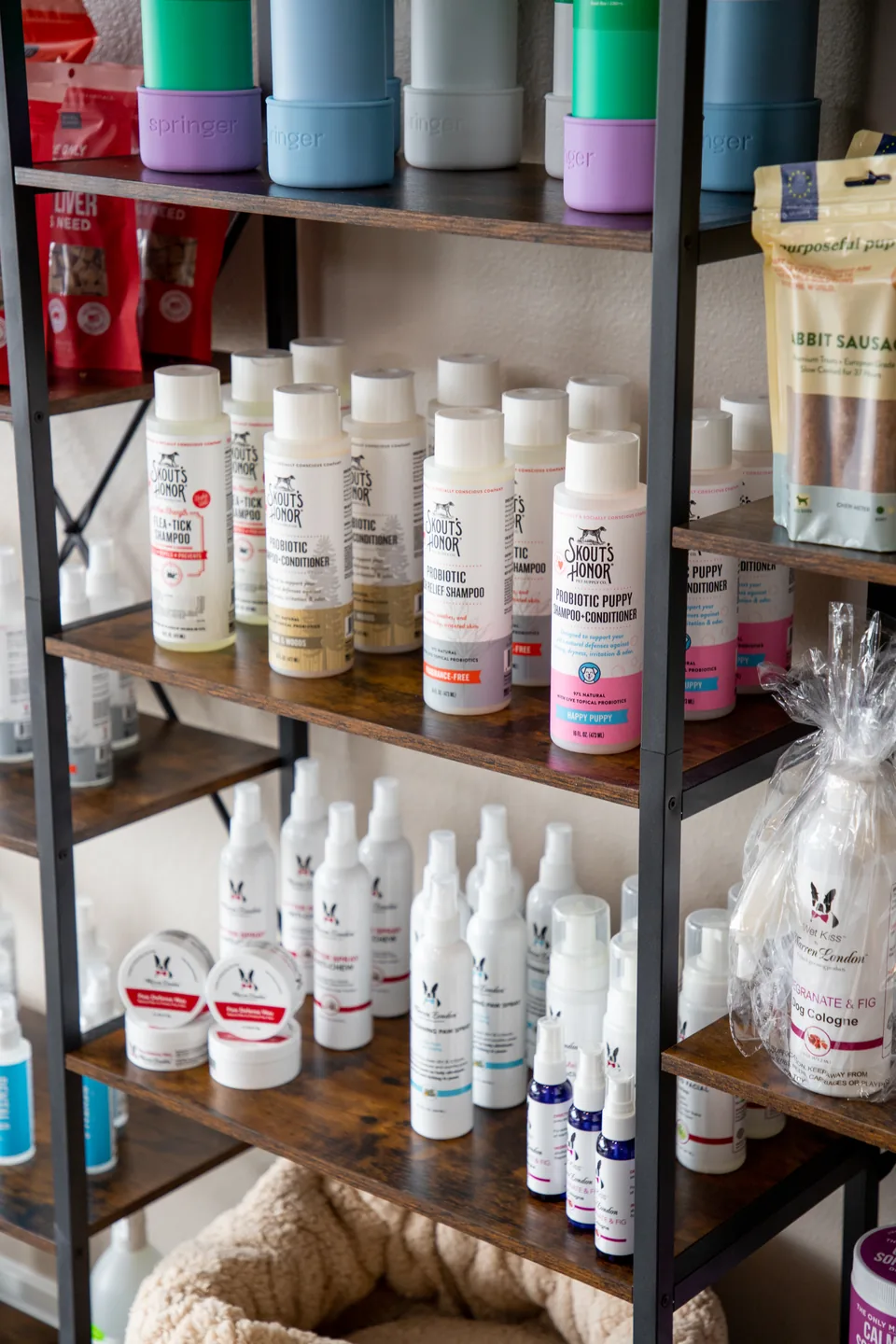 Professional shampoos and coat-care products on the shelves at Fur Seasons
